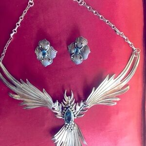 Carol Felley sterling silver earrings and necklace with blue topaz inset.